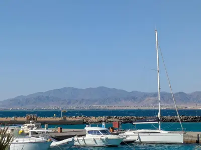 a group of boats docked in a harbor at 2BR Pool Front Soma bay Villa Near Mesca Beach in Hurghada