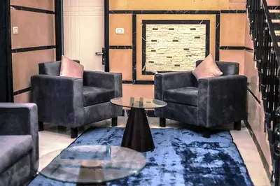 a living room with two chairs and a table at Hamed's House Luxor in Luxor