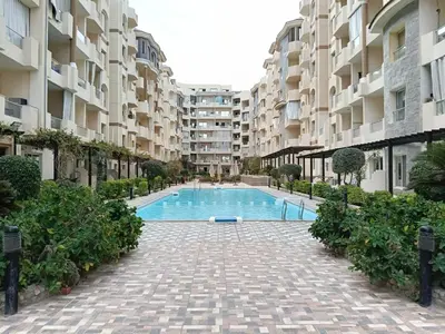 a swimming pool in the middle of a building at فلورانزا خمسين f012 in Hurghada