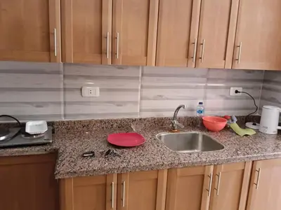 a kitchen with a sink and a counter top at فلورانزا خمسين f012 in Hurghada