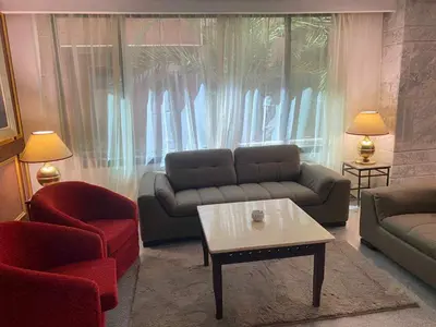 a living room with a couch and a coffee table at Grand Cleopatra Hotel-Luxor in Luxor