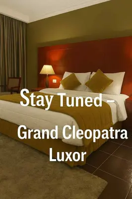 a bed in a hotel room with the words stay turned grand cecapa lug at Grand Cleopatra Hotel-Luxor in Luxor