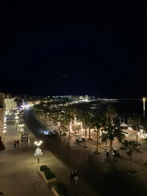 a city street at night with cars and lights at Tawaya Sahl Hasheesh 2 bedrooms in Hurghada