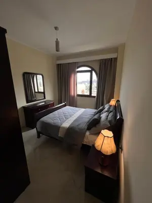 a bedroom with a large bed and a window at Gravity Apartment 410 beautiful apartment with view in structure Gravity Sahl Hasheesh -No Egyptian Passports in Hurghada