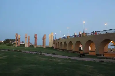 a bridge with people on it with a dog under it at 310 el Andalous Apartment in Hurghada