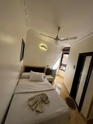 a bedroom with two beds in a room at Nubian Dreams guest house 2 in Aswan