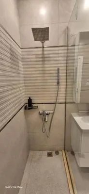 a bathroom with a shower and a sink at Modern studio with sea view und large roof terrace in Hurghada