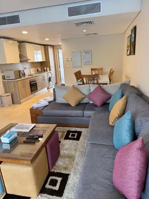 a living room with a couch and a table at Mangrove M1-5B-13 in Banī Ghālib
