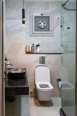 a small bathroom with a toilet and a sink at Cozy Luxe Apartment in Central Aswan in Aswan