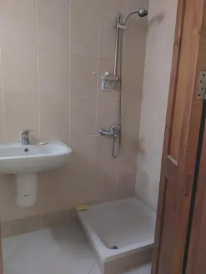 a bathroom with a sink and a toilet and a shower at Makadi Heights Apartment in Hurghada