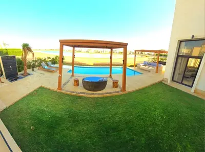 a backyard with a pool and a gazebo at El Gouna Cyan the Range 4BDs Villa with private Pool in Hurghada