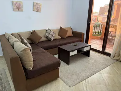 a living room with a couch and a coffee table at Amaizing 2BR Apartment B2 in Turtles Beach - Hurghada in Hurghada