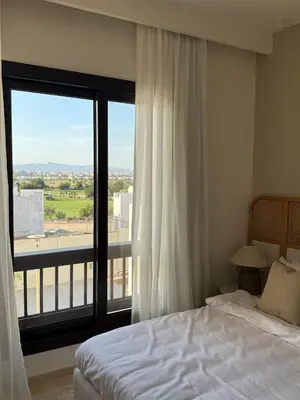 a hotel room with a bed and a large window at Ancient Sands Resort Gouna 1 Bedroom apartment with open view in Hurghada