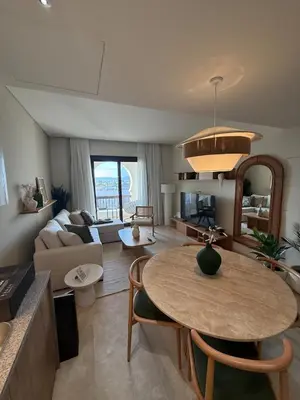 a living room with a table and a couch at Ancient Sands Resort Gouna 1 Bedroom apartment with open view in Hurghada