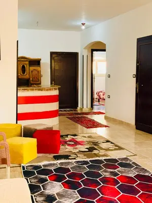 a living room with colorful furniture and a lobby at Luxor Old nile apartment in Luxor