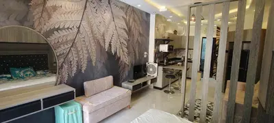 a living room with a couch and a wall mural at Juliana Beach Resort Hurghada A105 in Hurghada