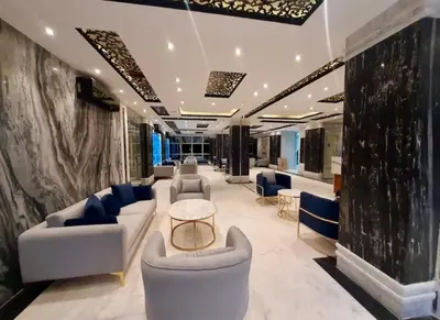 a lobby with couches and chairs and a table at Juliana Beach Resort Hurghada AG10 in Hurghada