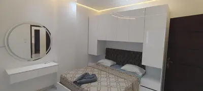 a small bedroom with a bed and a mirror at Juliana Beach Resort Hurghada AG10 in Hurghada