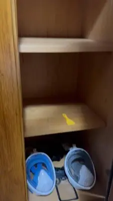 a cupboard with two blue toilets in it at katakitu in Hurghada