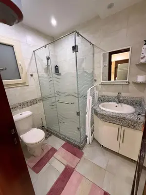 a bathroom with a shower and a toilet and a sink at Touristic centre beach2 in Hurghada