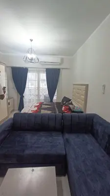 a living room with a couch and a bed at Juliana beach resort in Hurghada