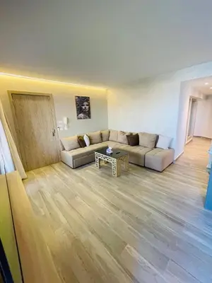 a living room with a couch and a table at New Marina Apartments in Hurghada