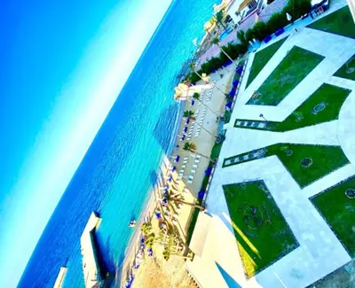 an overhead view of a beach with a rainbow at Juliana Beach Resort Hurghada D402 in Hurghada