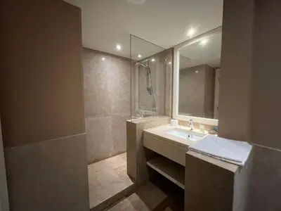 a bathroom with a sink and a mirror at Elegant 2BR Apartment • Ocean View Abu Tig Marina in Hurghada
