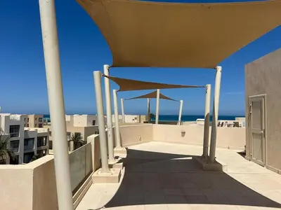 a building with a roof with a view of the ocean at 3 Bdr Sea View with private roof Mangrovy EL Guna in Hurghada