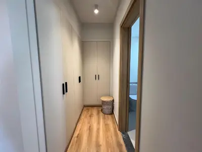 a hallway with a door to a room with a trash can at Bohemian-Style 3BR Townhouse in Shedwan, El Gouna. in Hurghada