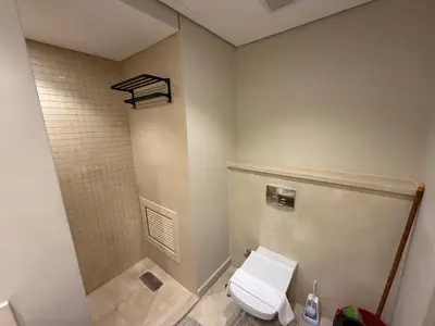 a bathroom with a white toilet in a room at Cozy 1BR GF Mangroovy Residence in Hurghada