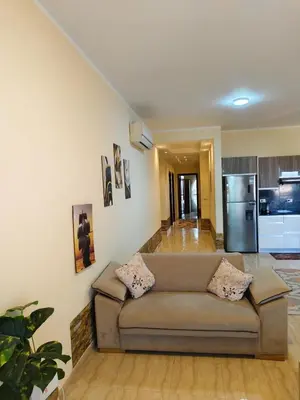 a living room with a couch and a kitchen at touristic center in Hurghada