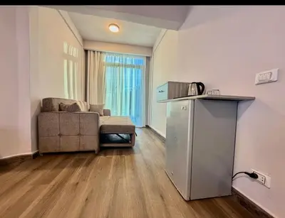 a living room with a couch and a table at Luxury flat in Hurghada