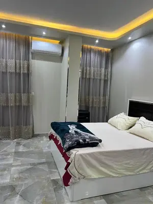 a bedroom with a large bed in a room at القيادات صف ثاني in Hurghada