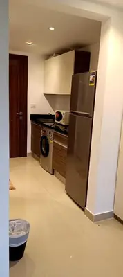 a kitchen with a stainless steel refrigerator and a dishwasher at Cozy studio G-cribs elgouna in Hurghada