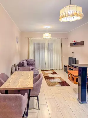 a living room with a couch and a table at Decoraive Appartment AlDaU Hurghada in Sahl Hasheesh