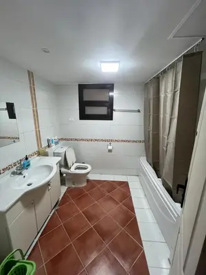 a bathroom with a toilet and a sink and a shower at Sea front 2 bedrooms apartment in Esplanada in Hurghada