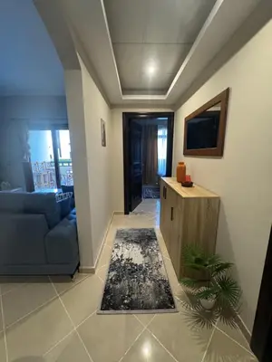 a living room with a couch and a table at Sahl Hasheesh Finest Chalet - Gravity resort beachfront family 2 bedroom - garden pools view waterpark NON EGYPTIAN ONLY in Hurghada