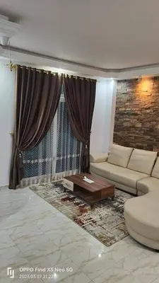 a living room with a couch and a coffee table at Private villa with swimming pool in Hurghada