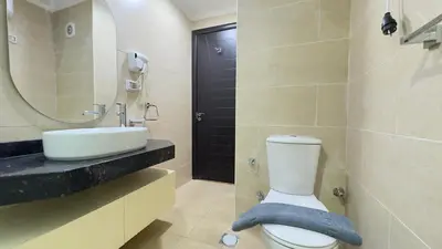 a bathroom with a toilet and a sink and a mirror at Galaxy Aldau Hieghts in Hurghada