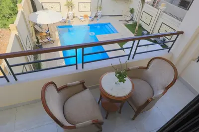 an overhead view of a pool with chairs and a table at Elbakry Hotel Luxor in Luxor