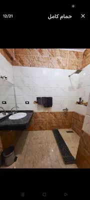 a bathroom with a sink and a toilet in it at Casablanca guest house᭄ꦿ in Luxor