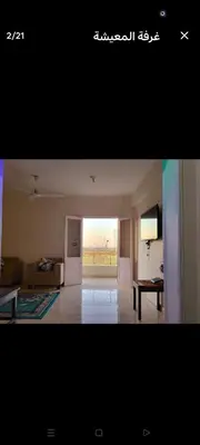 a living room with a couch and a room with a view at Casablanca guest house᭄ꦿ in Luxor