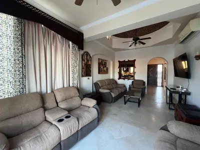 a living room with two couches and a couch at Waterfront Sabina I 4Bdr Retreat - Heated Pool in Hurghada