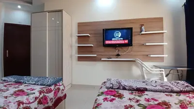 a bedroom with a bed and a tv on a wall at Casablanca beach in Hurghada