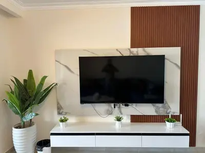 a flat screen tv on a wall in a living room at The View Hurghada in Hurghada