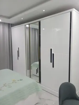 a bedroom with a bed and a mirror at fanadir resort in Hurghada