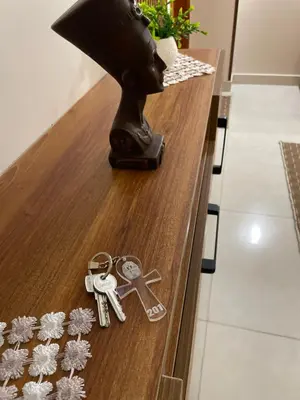 a table with keys and a lamp on it at Luxe Nest Luxor Serviced Apartments 201 in Luxor