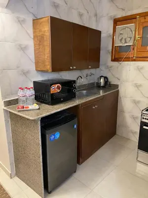 a kitchen with a sink and a dishwasher at Luxe Nest Luxor Serviced Apartments 201 in Luxor