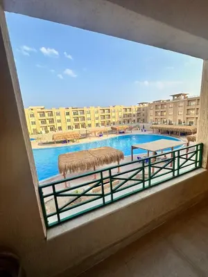 a balcony with a view of a swimming pool at Sahl Hasheesh in Hurghada